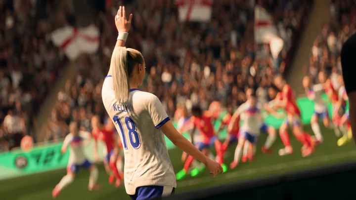 Chloe Kelly in an England kit raising her hand before a set piece.